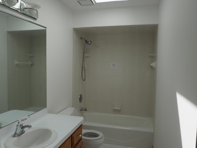 bathroom featuring bathtub / shower combination, vanity, and toilet