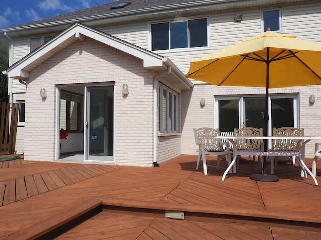 deck with outdoor dining area