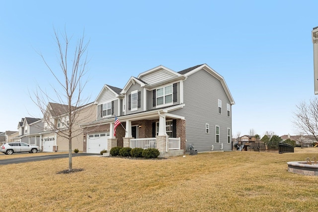 craftsman-style house featuring brick siding, covered porch, concrete driveway, an attached garage, and a front lawn