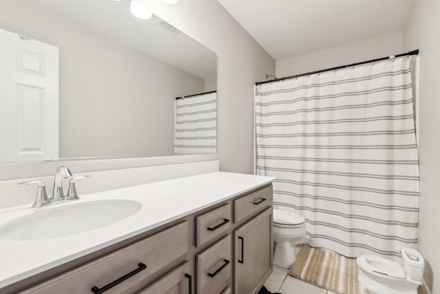 bathroom with toilet, visible vents, and vanity