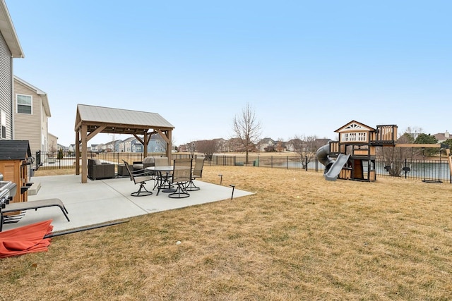 view of yard featuring playground community, a fenced backyard, a patio, and a gazebo