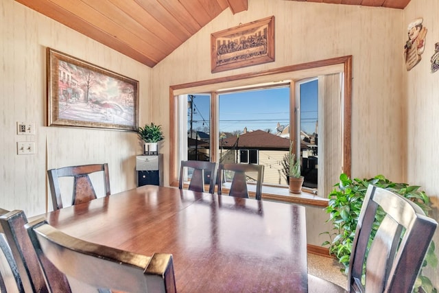 dining area with lofted ceiling and wood ceiling