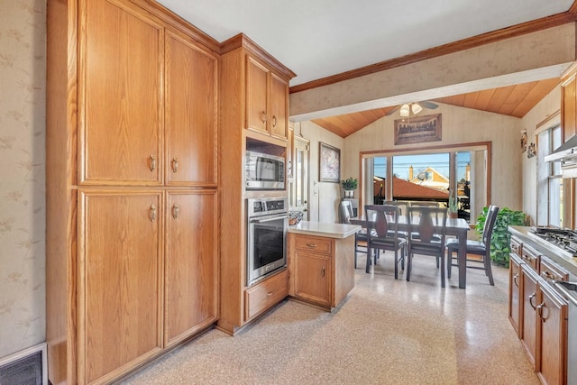 kitchen featuring stainless steel appliances, brown cabinetry, visible vents, and vaulted ceiling