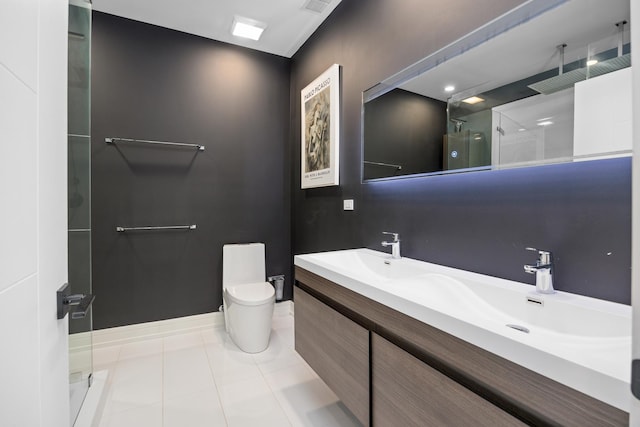 full bath featuring double vanity, toilet, walk in shower, baseboards, and tile patterned floors