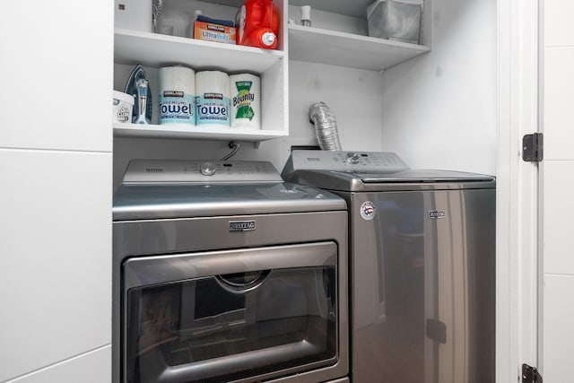 laundry area with laundry area and washer and clothes dryer