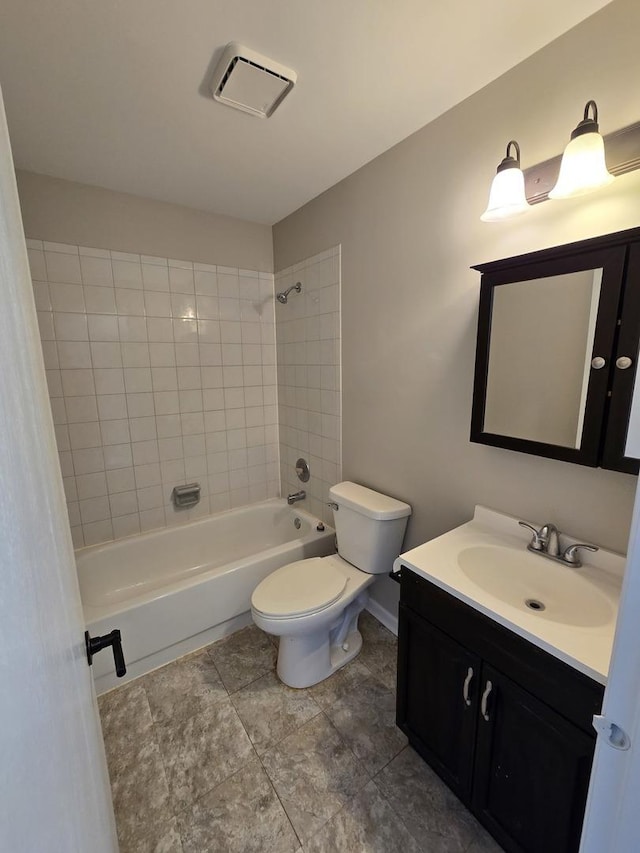 bathroom featuring visible vents, toilet, tub / shower combination, vanity, and baseboards