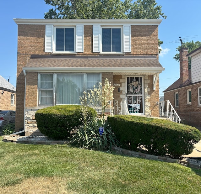 2820 W 84th St, Chicago, IL 60652 - view of front facade featuring stone siding, a front yard, roof with shingles, and covered porch