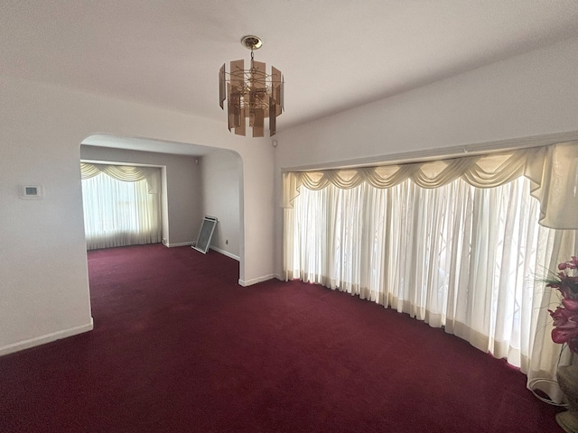 2820 W 84th St, Chicago, IL 60652 - empty room featuring arched walkways and carpet flooring