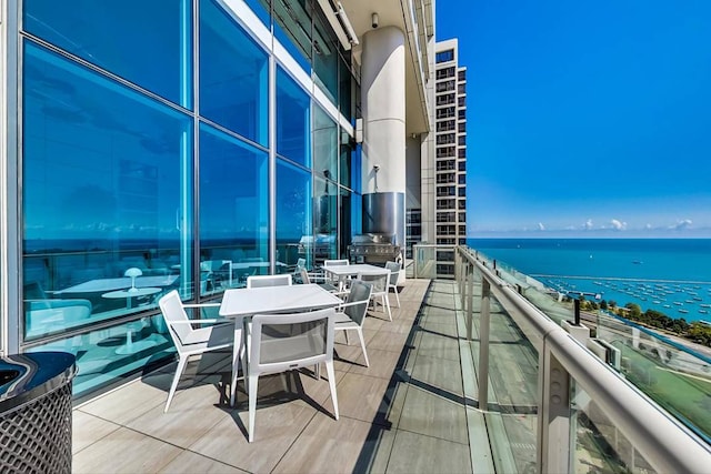 balcony featuring a water view