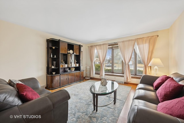 living area featuring visible vents and light wood finished floors