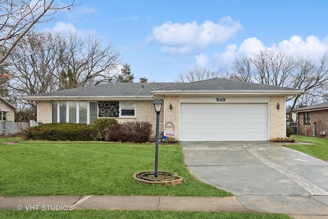 ranch-style house featuring an attached garage, driveway, brick siding, and a front yard