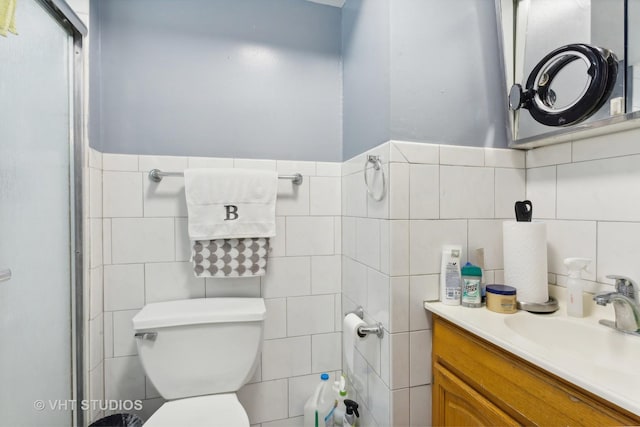 7311 N Ashland Blvd Unit 2A, Chicago, IL 60626 - bathroom with tile walls, vanity, and a shower with door