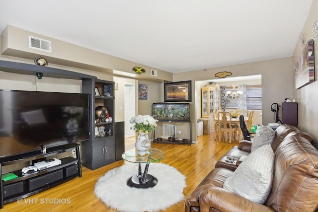 7311 N Ashland Blvd Unit 2A, Chicago, IL 60626 - living area featuring a chandelier and light wood-type flooring