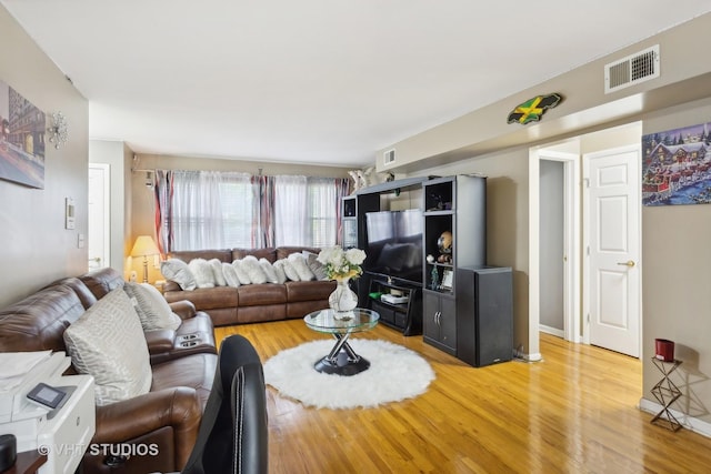7311 N Ashland Blvd Unit 2A, Chicago, IL 60626 - living room featuring light wood-style flooring and baseboards