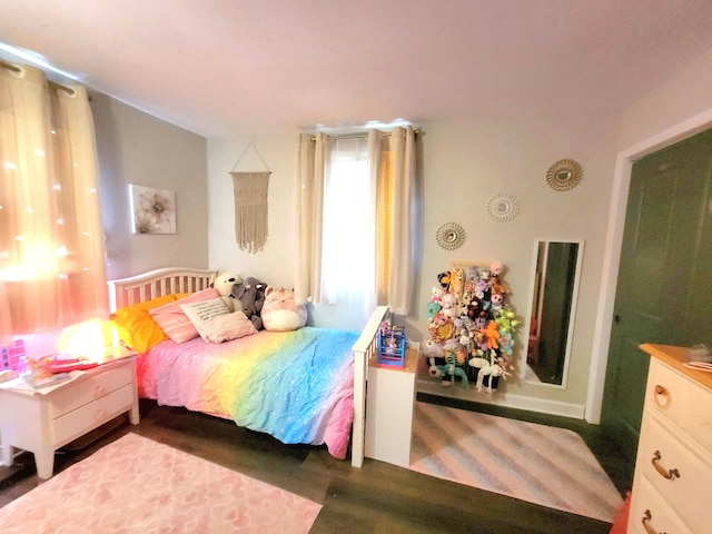 bedroom featuring wood finished floors