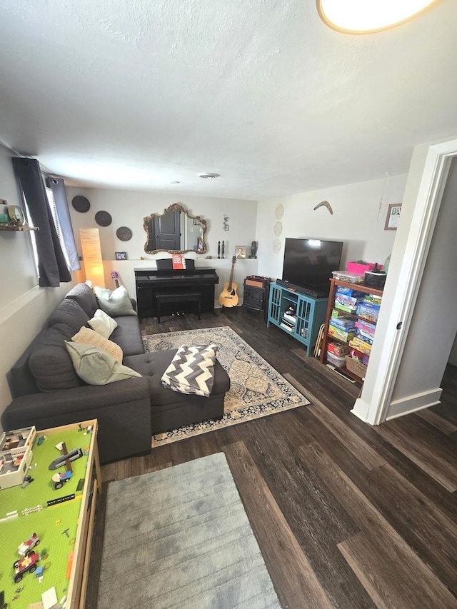 living room with wood finished floors and a textured ceiling