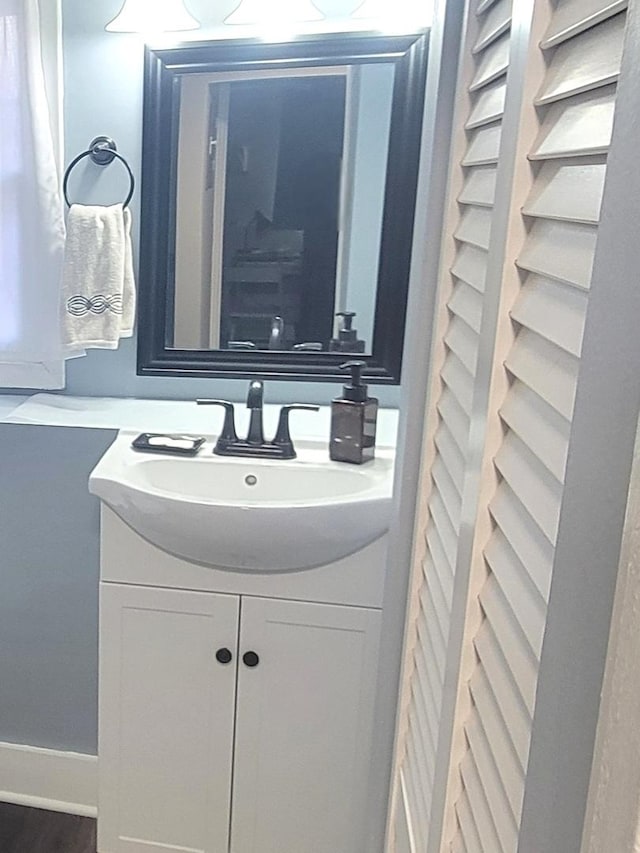 bathroom featuring vanity and baseboards