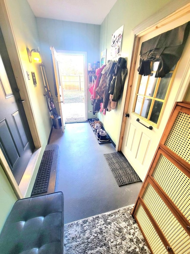 doorway with visible vents and concrete floors