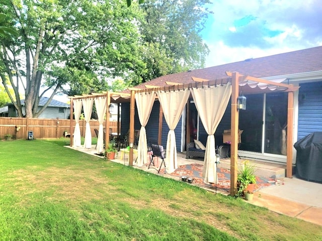 rear view of property featuring a patio area, a lawn, a pergola, and fence