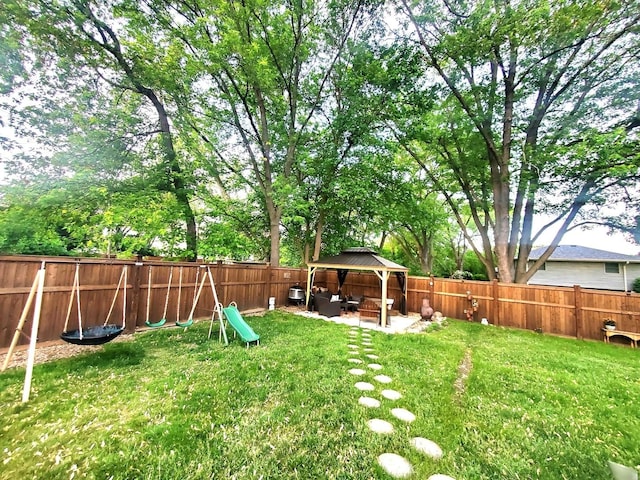 view of yard with a gazebo, a fenced backyard, and a patio area