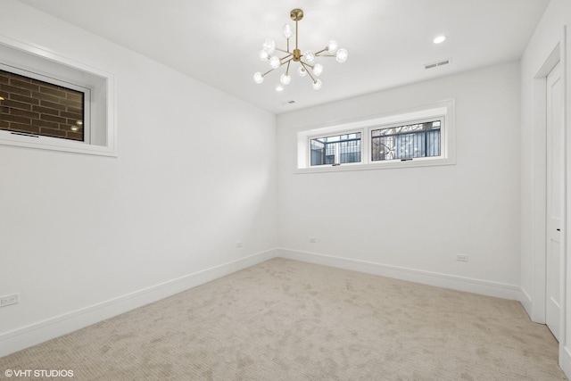 carpeted empty room featuring recessed lighting, visible vents, a notable chandelier, and baseboards