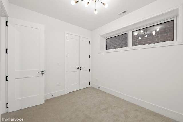 unfurnished bedroom with baseboards, a closet, visible vents, and carpet flooring