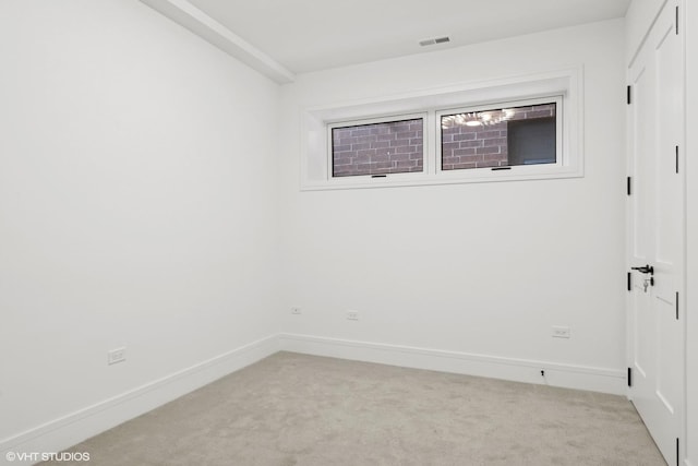 unfurnished room featuring carpet floors, baseboards, and visible vents