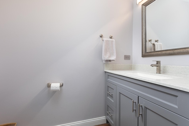 bathroom featuring vanity and baseboards