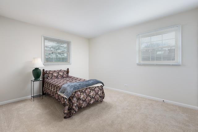 carpeted bedroom with baseboards