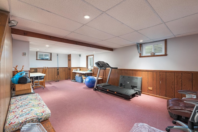 exercise room featuring recessed lighting, wainscoting, carpet flooring, and wooden walls