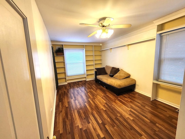 unfurnished room featuring ceiling fan, wood finished floors, and baseboards