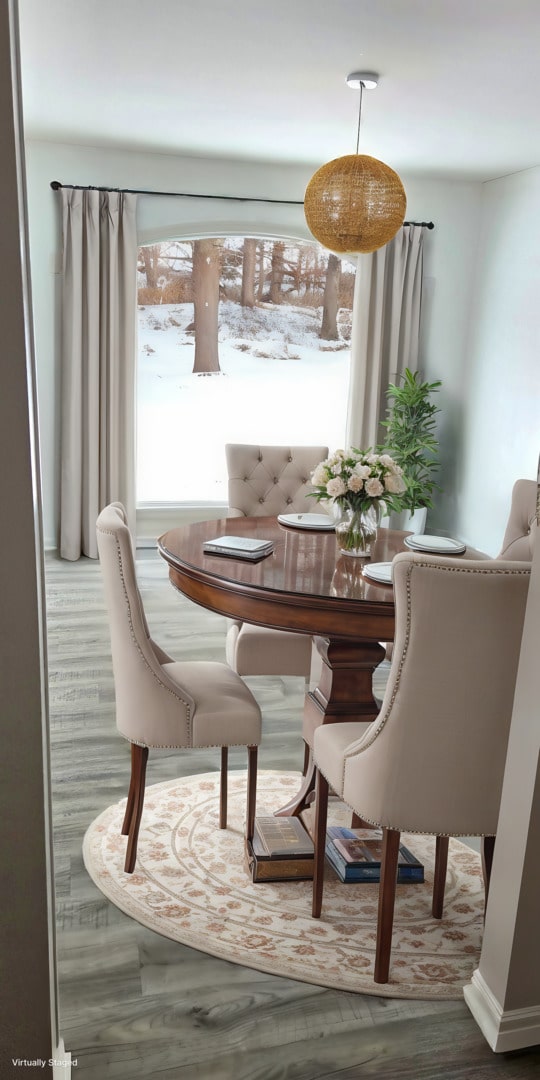 dining space featuring wood finished floors