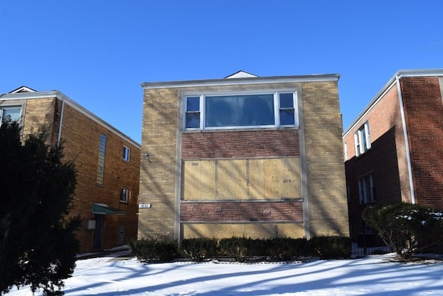 exterior space featuring brick siding