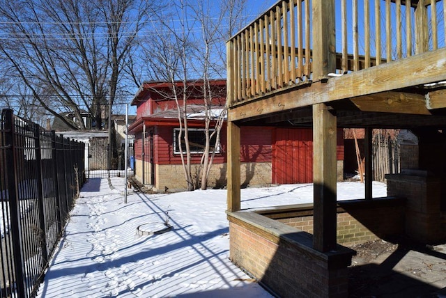 snow covered patio with fence