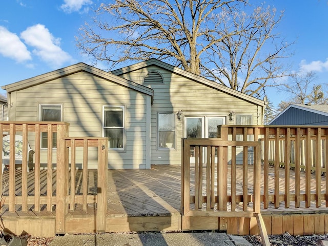 back of house featuring a deck