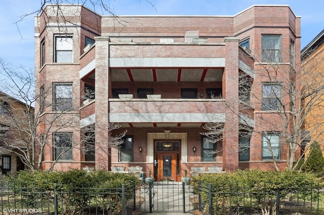 view of building exterior with a fenced front yard