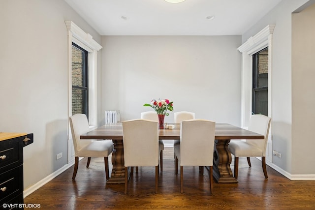 dining space with recessed lighting, baseboards, and wood finished floors