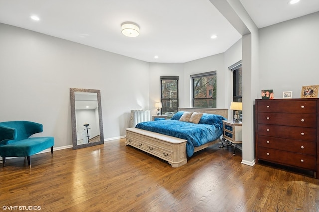 bedroom with recessed lighting, baseboards, and wood finished floors