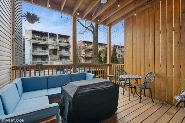 wooden deck featuring outdoor lounge area