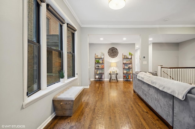 living area featuring crown molding, recessed lighting, wood finished floors, and baseboards