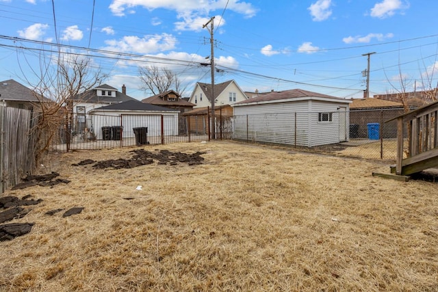 view of yard with an outbuilding and a fenced backyard