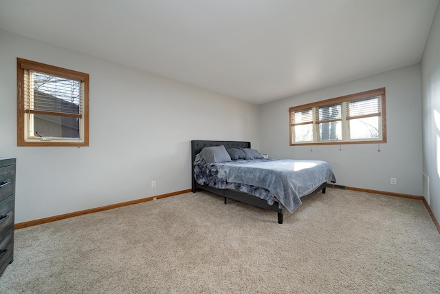 bedroom with carpet flooring and baseboards