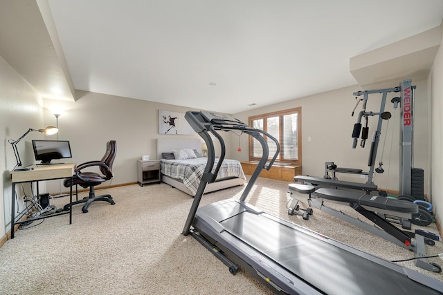 workout area featuring carpet floors and baseboards