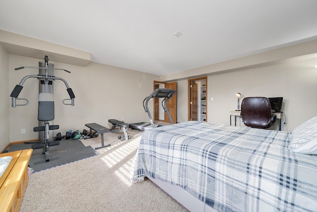 carpeted bedroom featuring baseboards