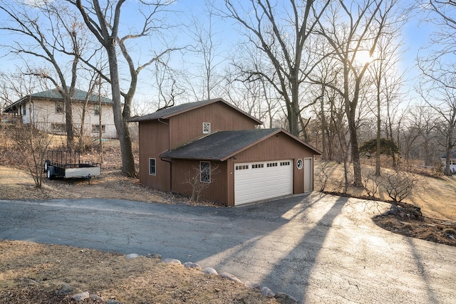 view of property exterior with a shingled roof