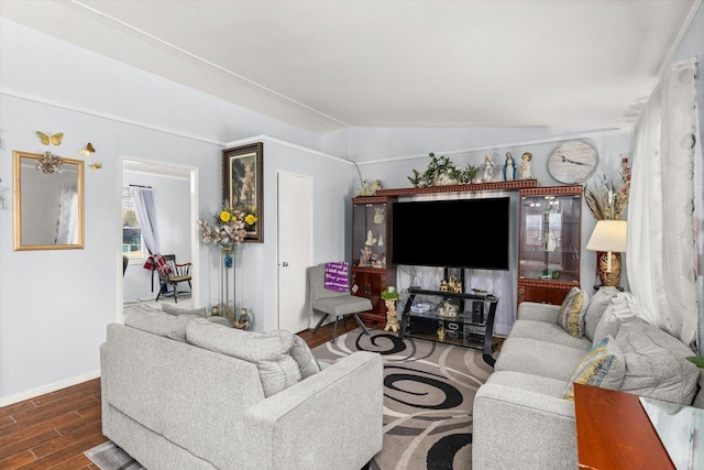 living area featuring baseboards and wood finished floors