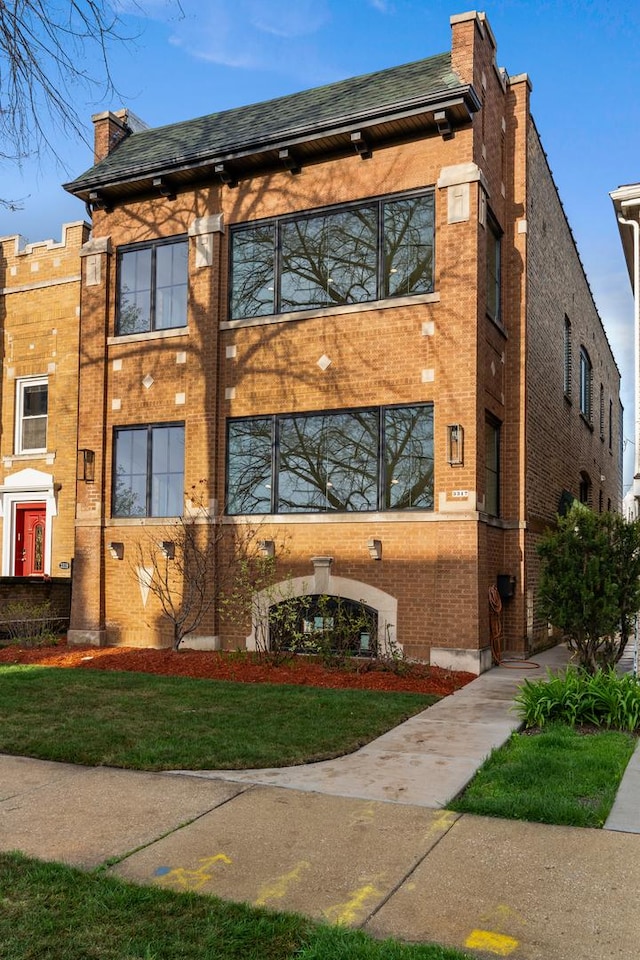 exterior space featuring brick siding