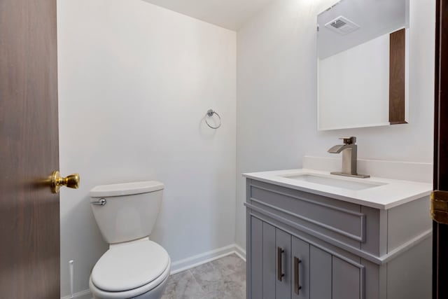 bathroom featuring toilet, baseboards, visible vents, and vanity