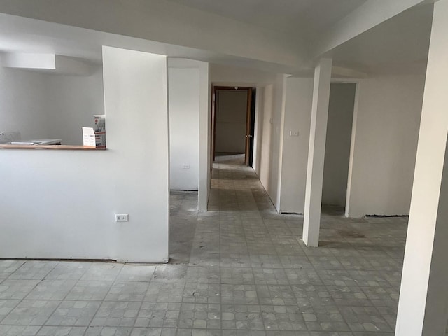 hallway with tile patterned floors