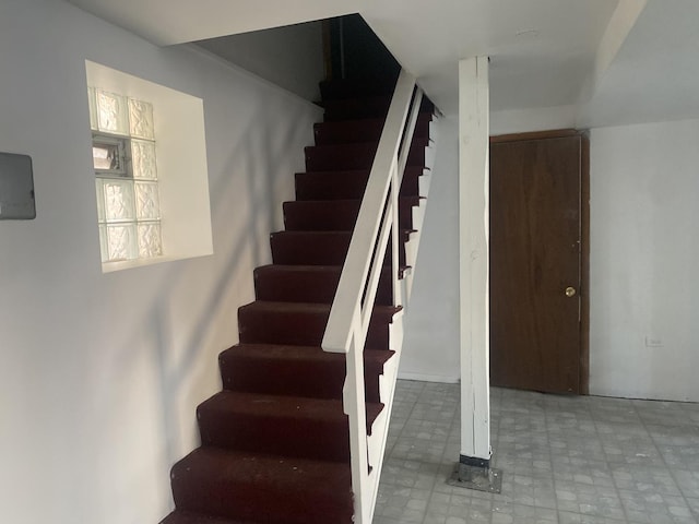 stairway featuring tile patterned floors